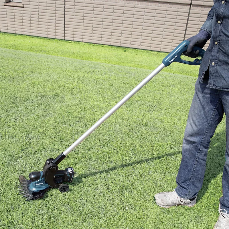 UM600DSMEX akkuruohosakset 10,8 V sininen musta 2x litiumioniakku 4,0 Ah