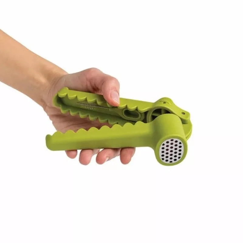 Kahvalla varustettu valkosipulipuristin Ototo Design Garligator vihreä muovi teräs