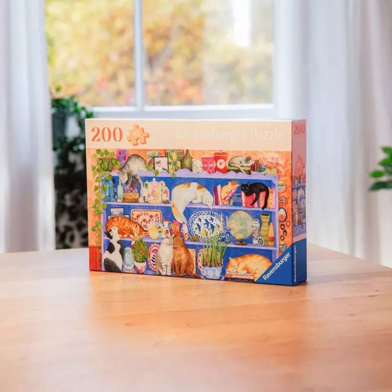 Palapeli Ravensburger Feel Well & Puzzle Cats on the Shelf – 200 palaa