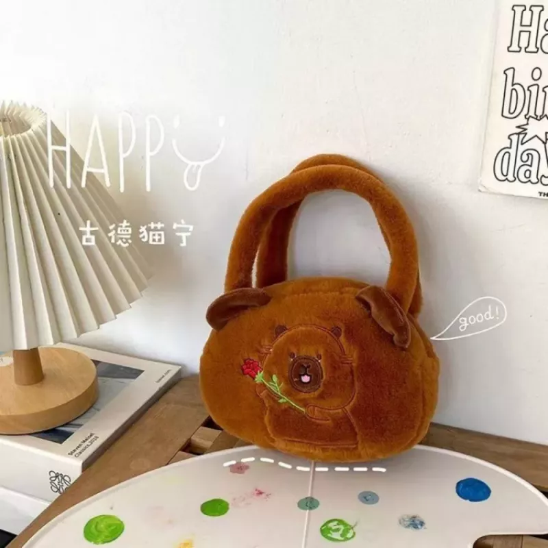 LEAN TOYS kapybara pehmolaukku ruusulla, ruskea, 20 cm