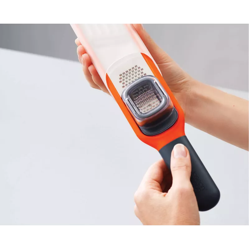 Joseph Joseph Handi-Grate 2-in-1 mini raastin & viipalointileikkuri - oranssi - ruostumaton teräs