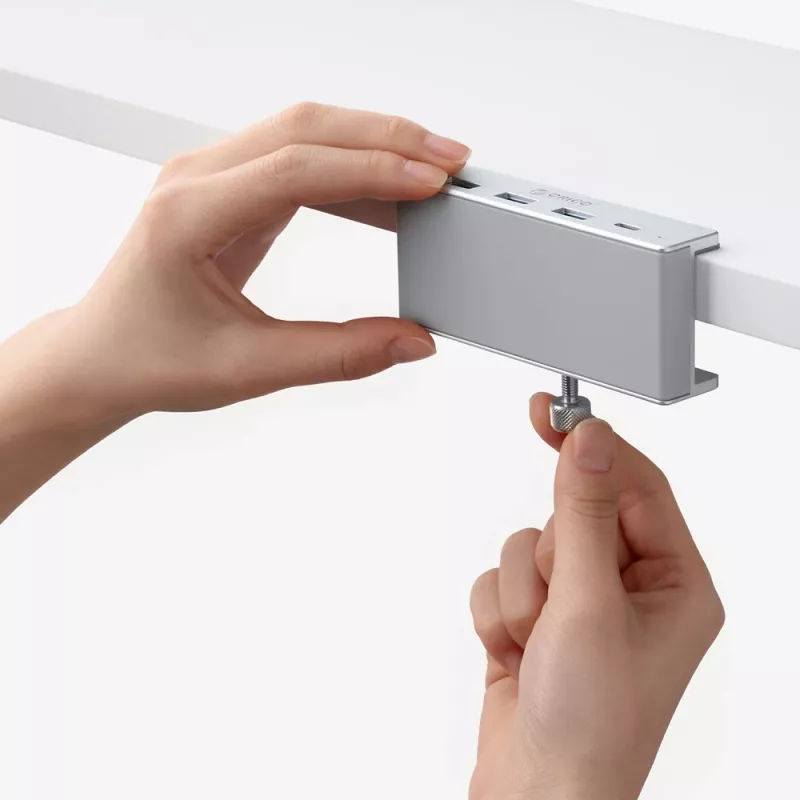 ORICO MH4PC USB-C-keskitin puristuskiinnitteinen, 3x USB-A 3.0 + 1x USB-C 3.0, hopea